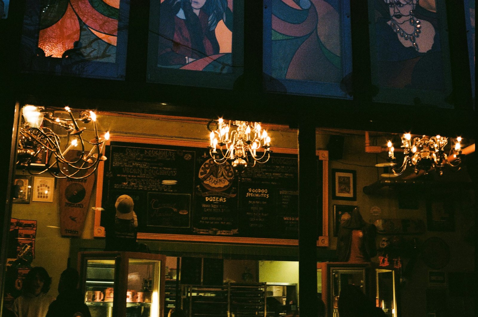 A restaurant with a chandelier hanging from the ceiling